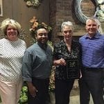 Mary Ann Kutnick (second from right) of Schaefer Greenhouses Inc. in Montgomery, Illinois, receives an FTD 75-year anniversary recognition plaque from (left to right) FTD Regional Vice President Wendy McGoff, FTD Field Business Consultant Edgar DeLaGarza and FTD Florist EVP Tom Moeller.