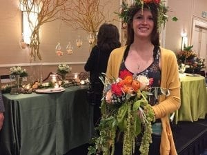 Destinee Fish of Jenny’s Floral in Custer, S.C., models a “Bohemian” flower crown and bouquet as part of Jerome Raska’s program, “Events from Concept to Completion.” 
