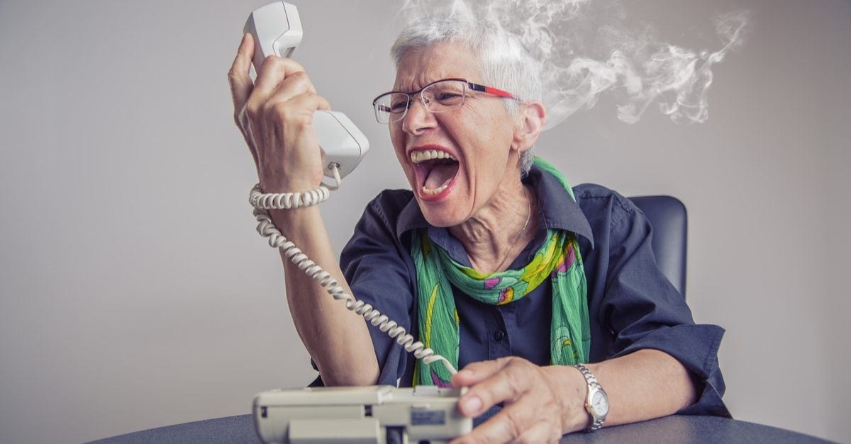 stock art of a senior female yelling at a phone